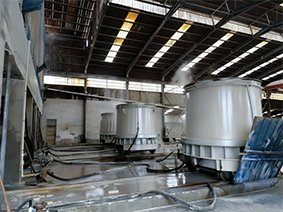Industrial facility with large equipment for white fused alumina production, showcasing the manufacturing process of high-purity alumina materials